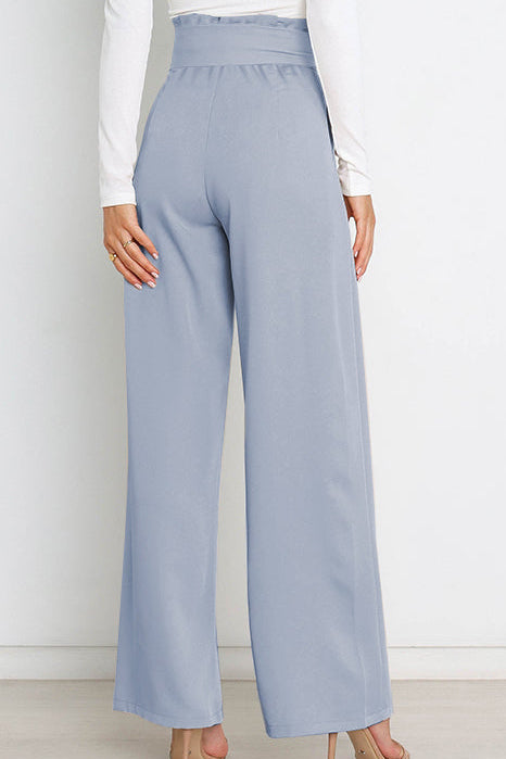 Woman wearing paperbag waist wide leg pants