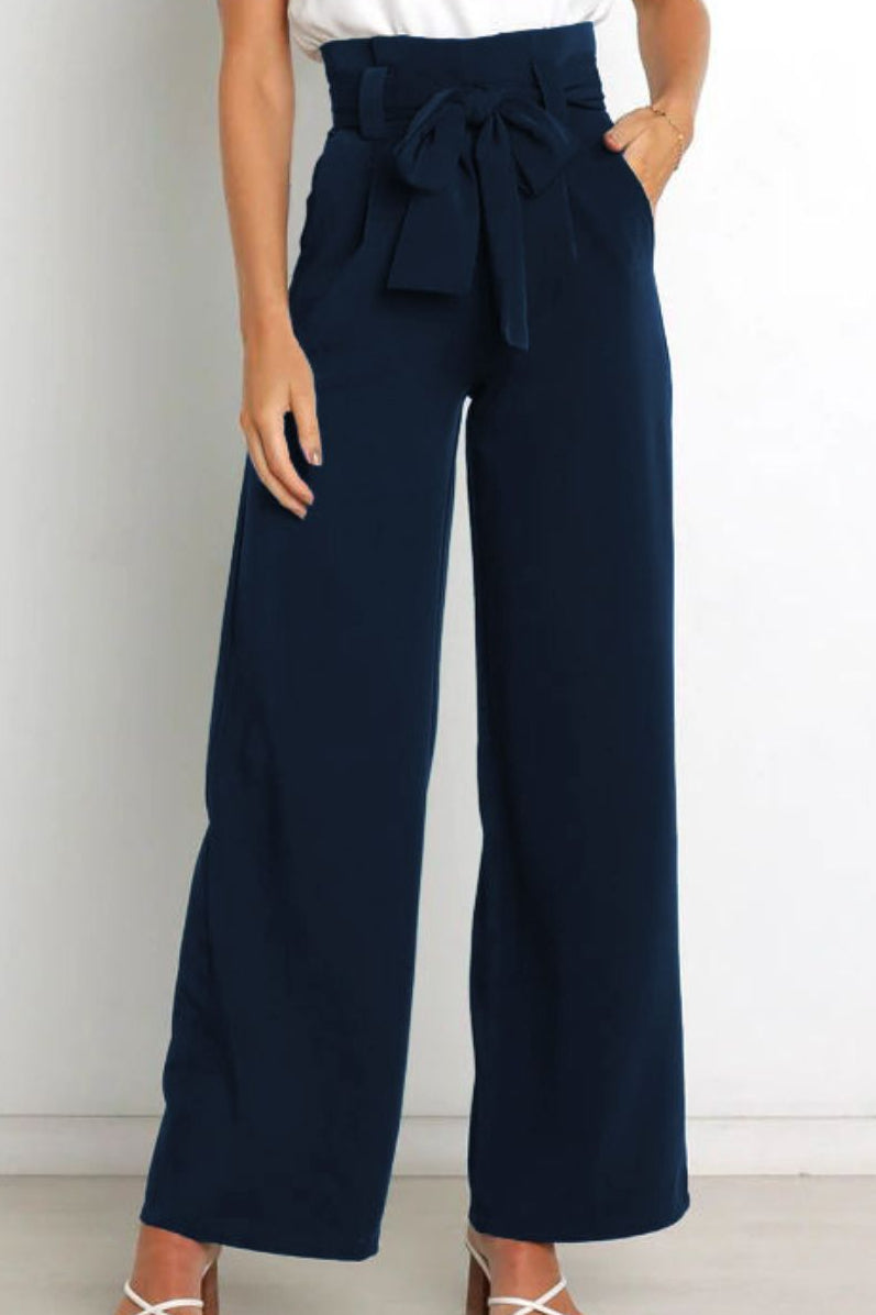 Woman wearing paperbag waist wide leg pants