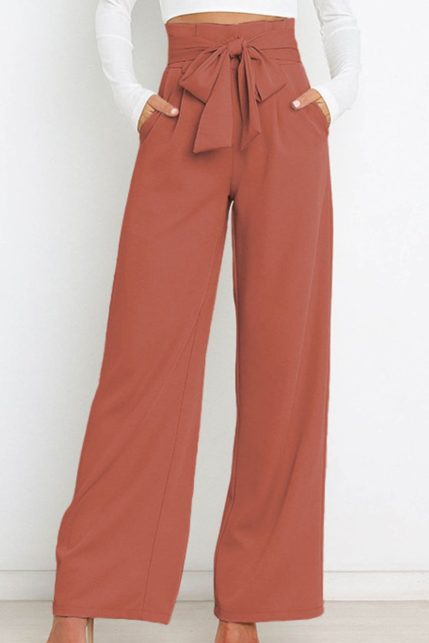 Woman wearing paperbag waist wide leg pants