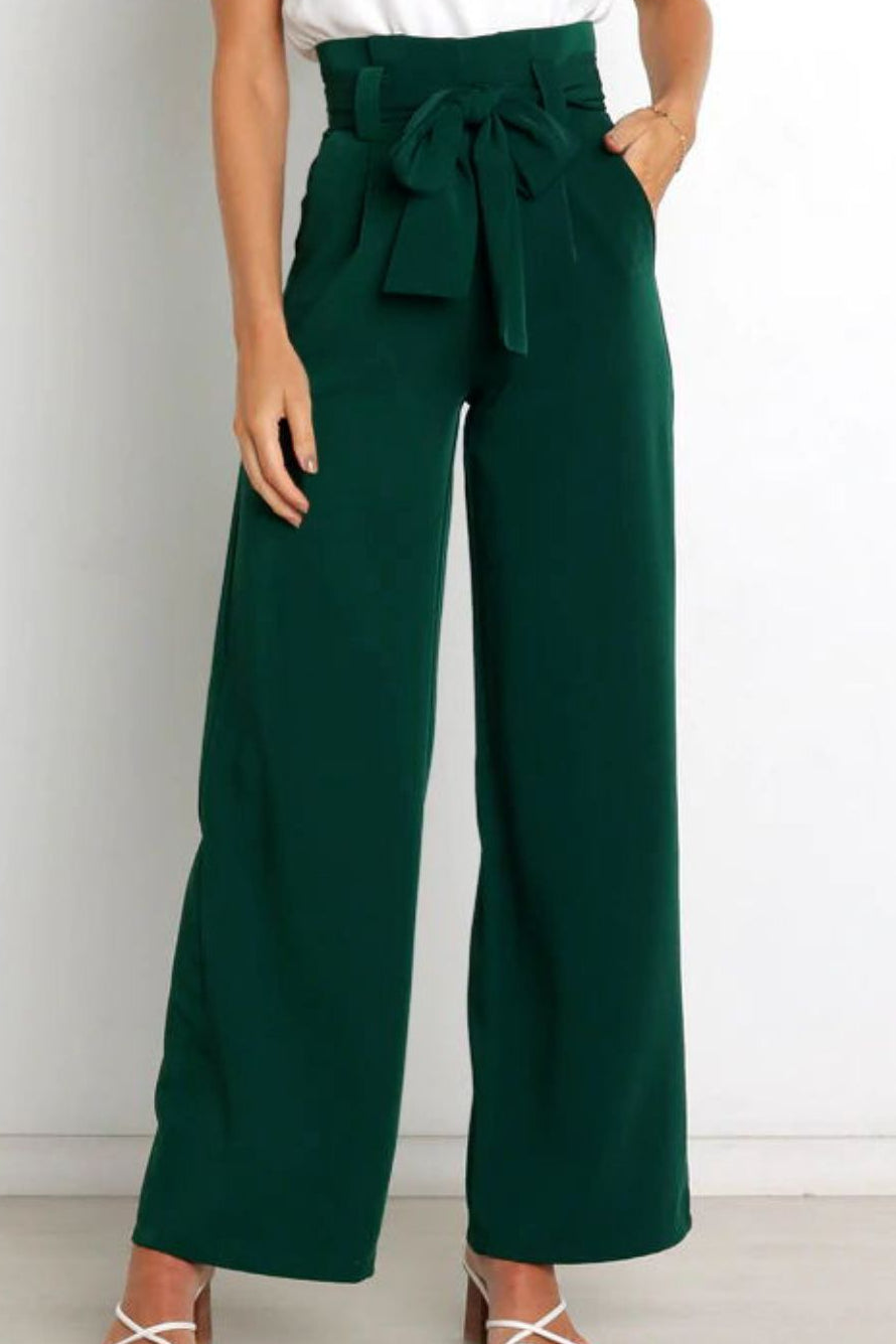 Woman wearing paperbag waist wide leg pants