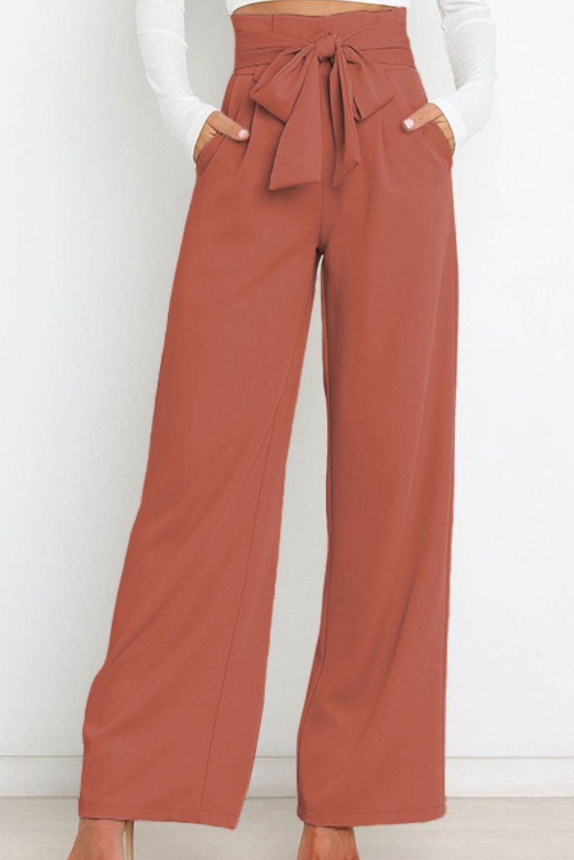 Woman wearing paperbag waist wide leg pants