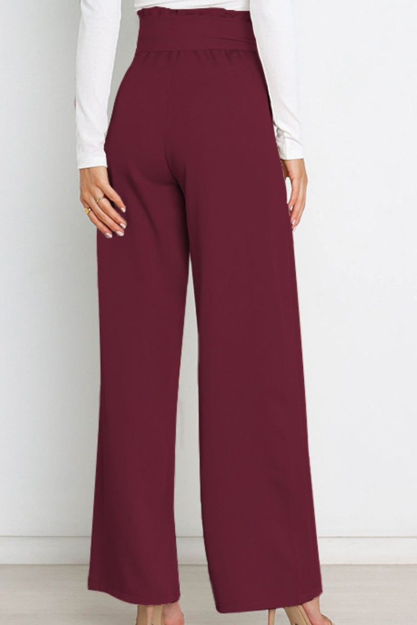Woman wearing paperbag waist wide leg pants