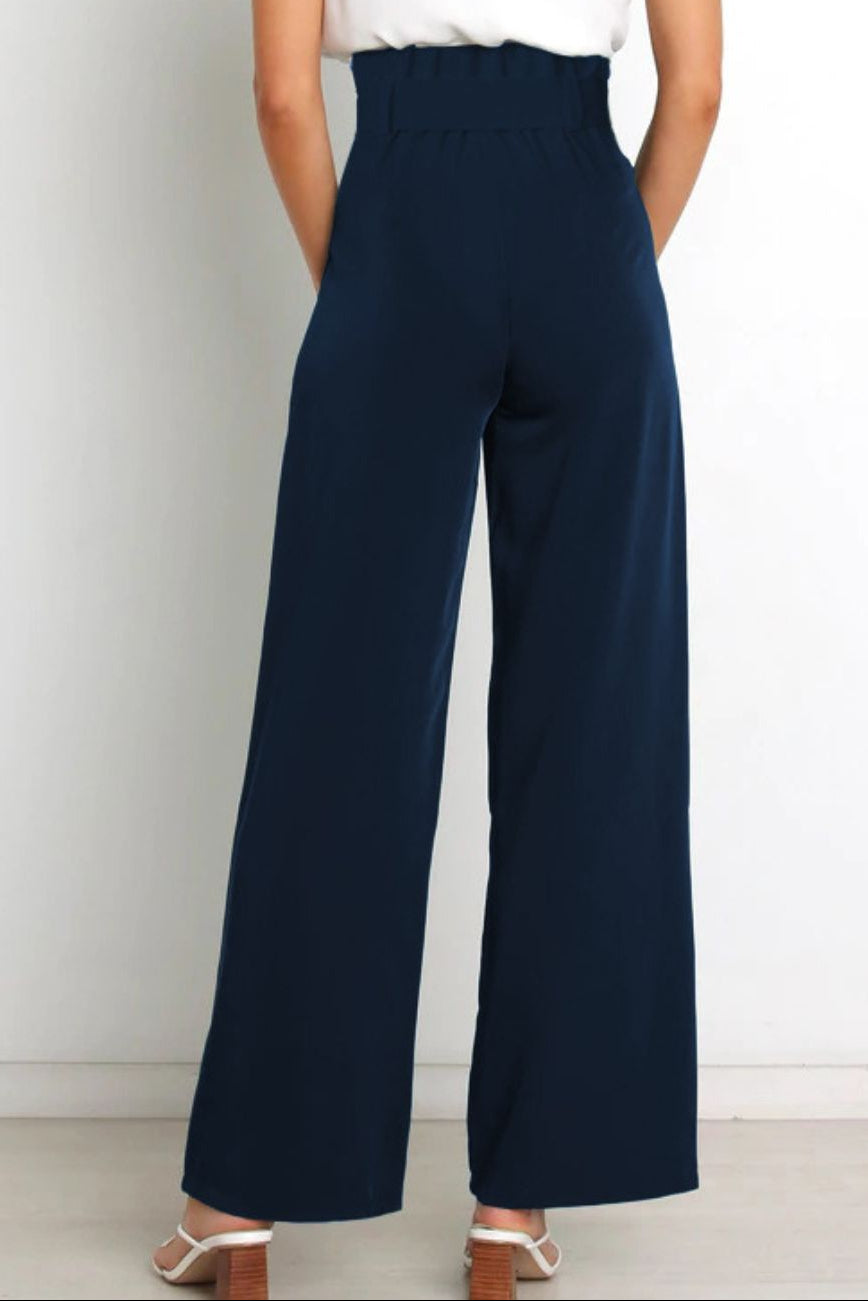 Woman wearing paperbag waist wide leg pants