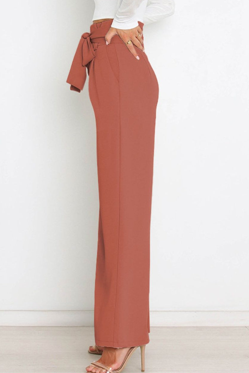 Woman wearing paperbag waist wide leg pants