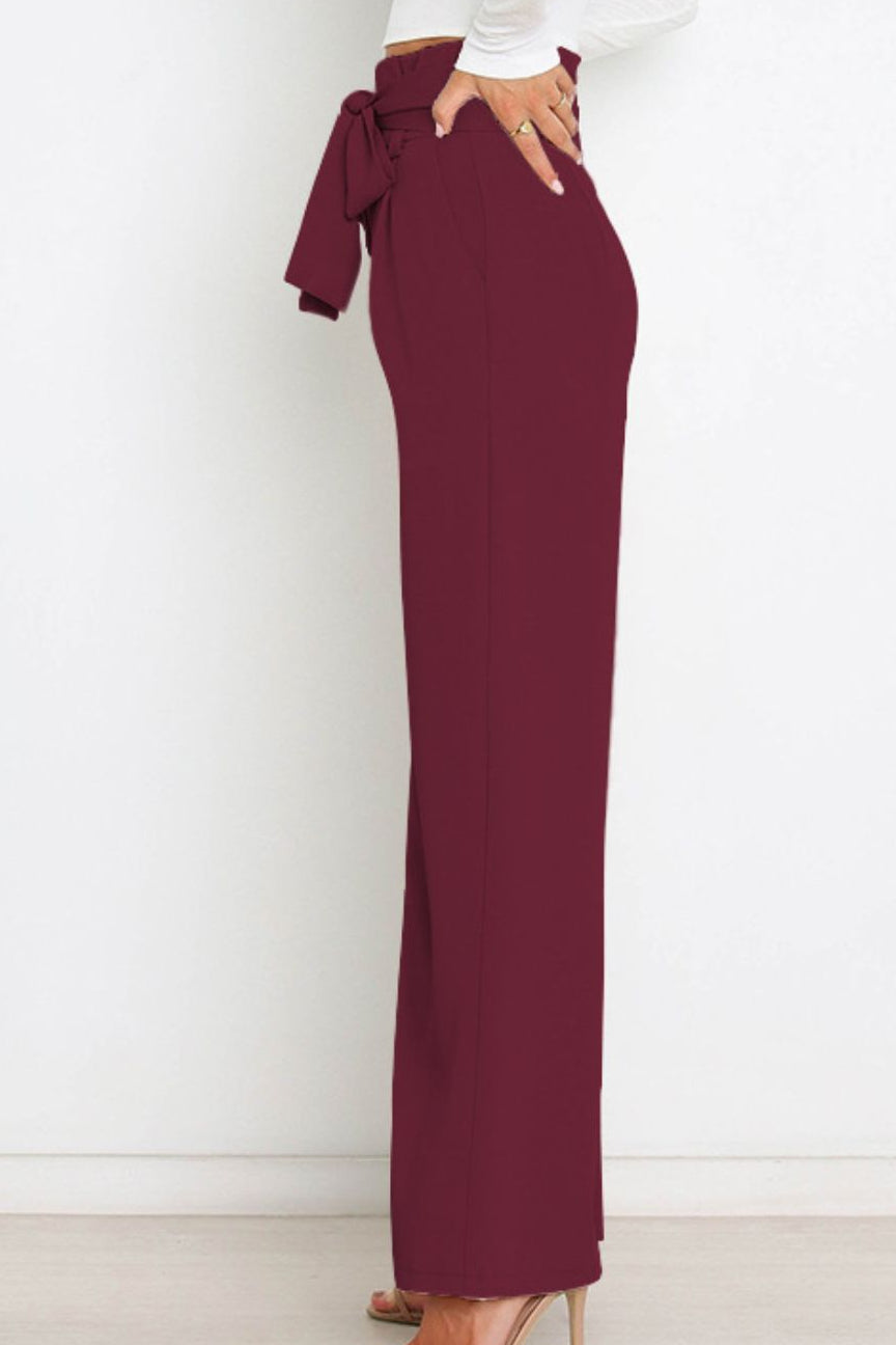 Woman wearing paperbag waist wide leg pants