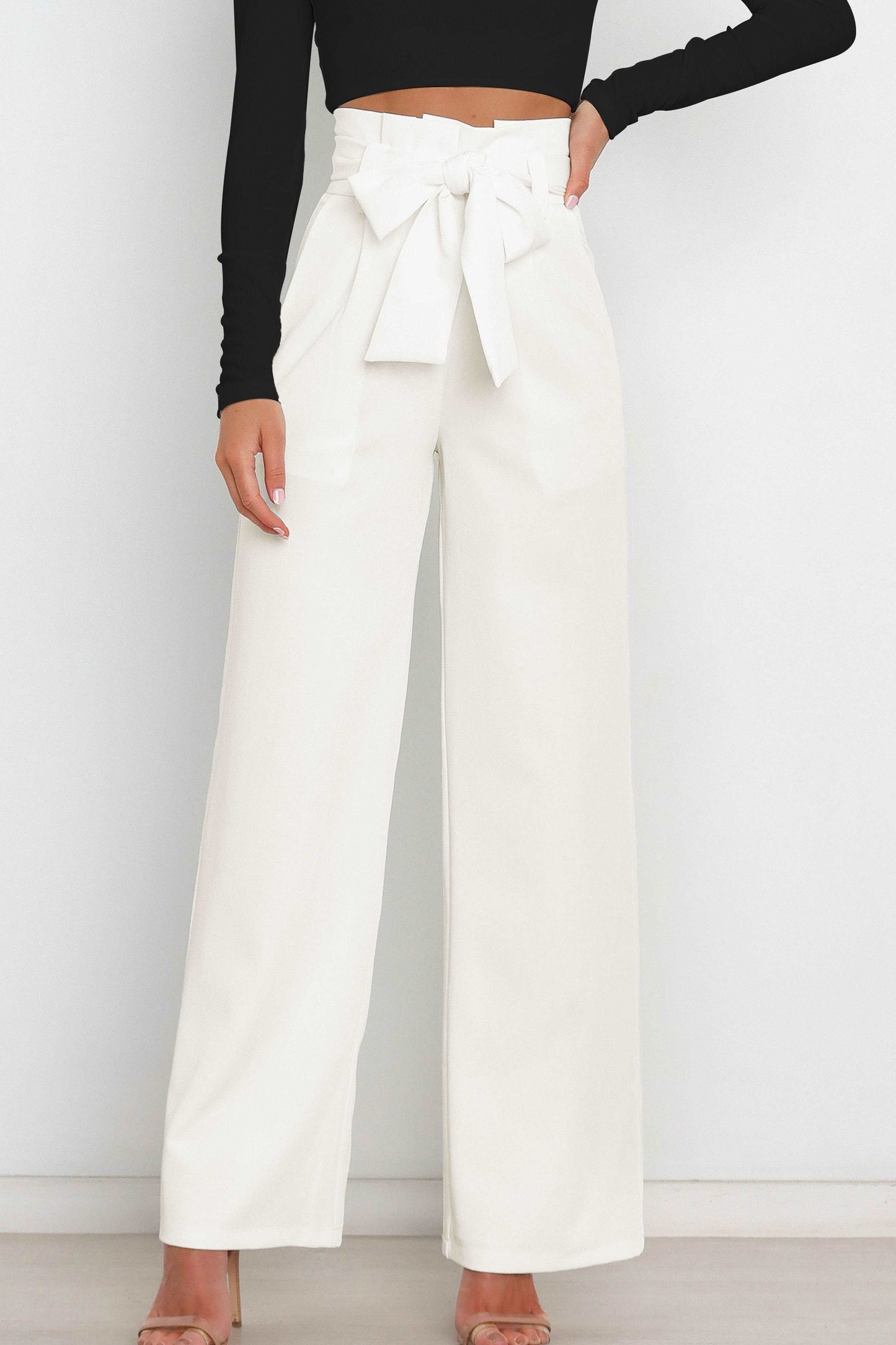 Woman wearing paperbag waist wide leg pants