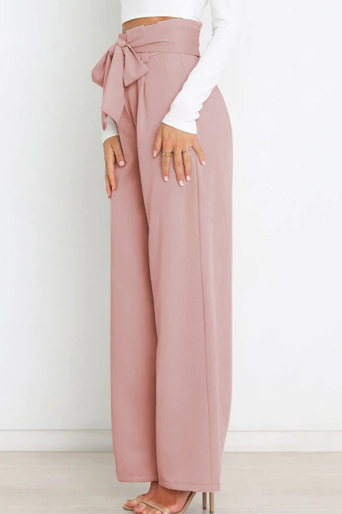 Woman wearing paperbag waist wide leg pants