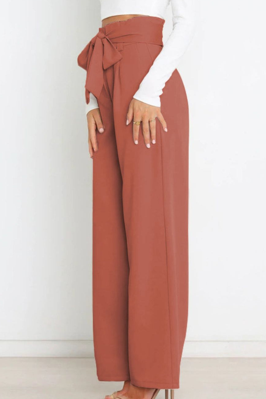 Woman wearing paperbag waist wide leg pants