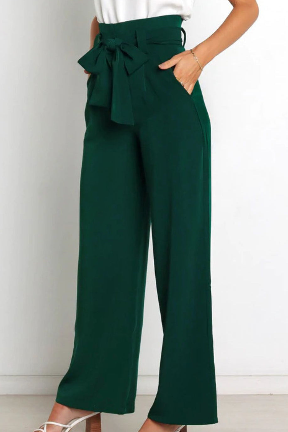 Woman wearing paperbag waist wide leg pants