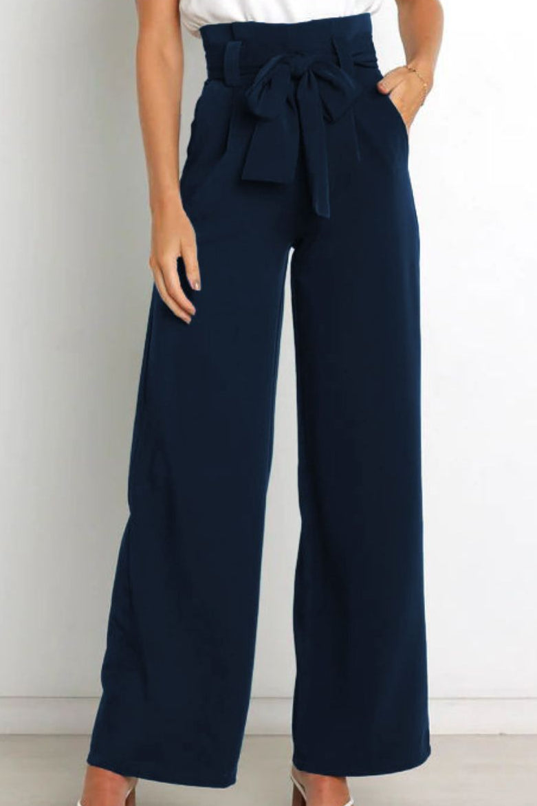 Woman wearing paperbag waist wide leg pants