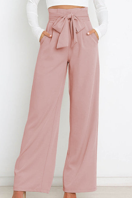 Woman wearing paperbag waist wide leg pants
