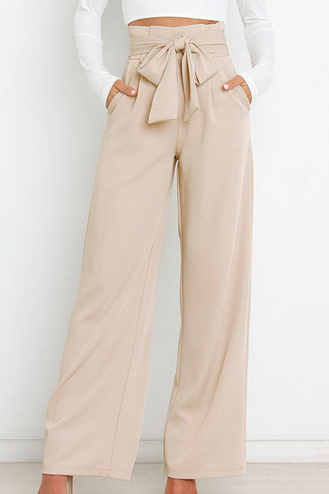 Woman wearing paperbag waist wide leg pants