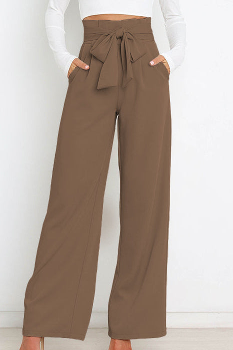 Woman wearing paperbag waist wide leg pants