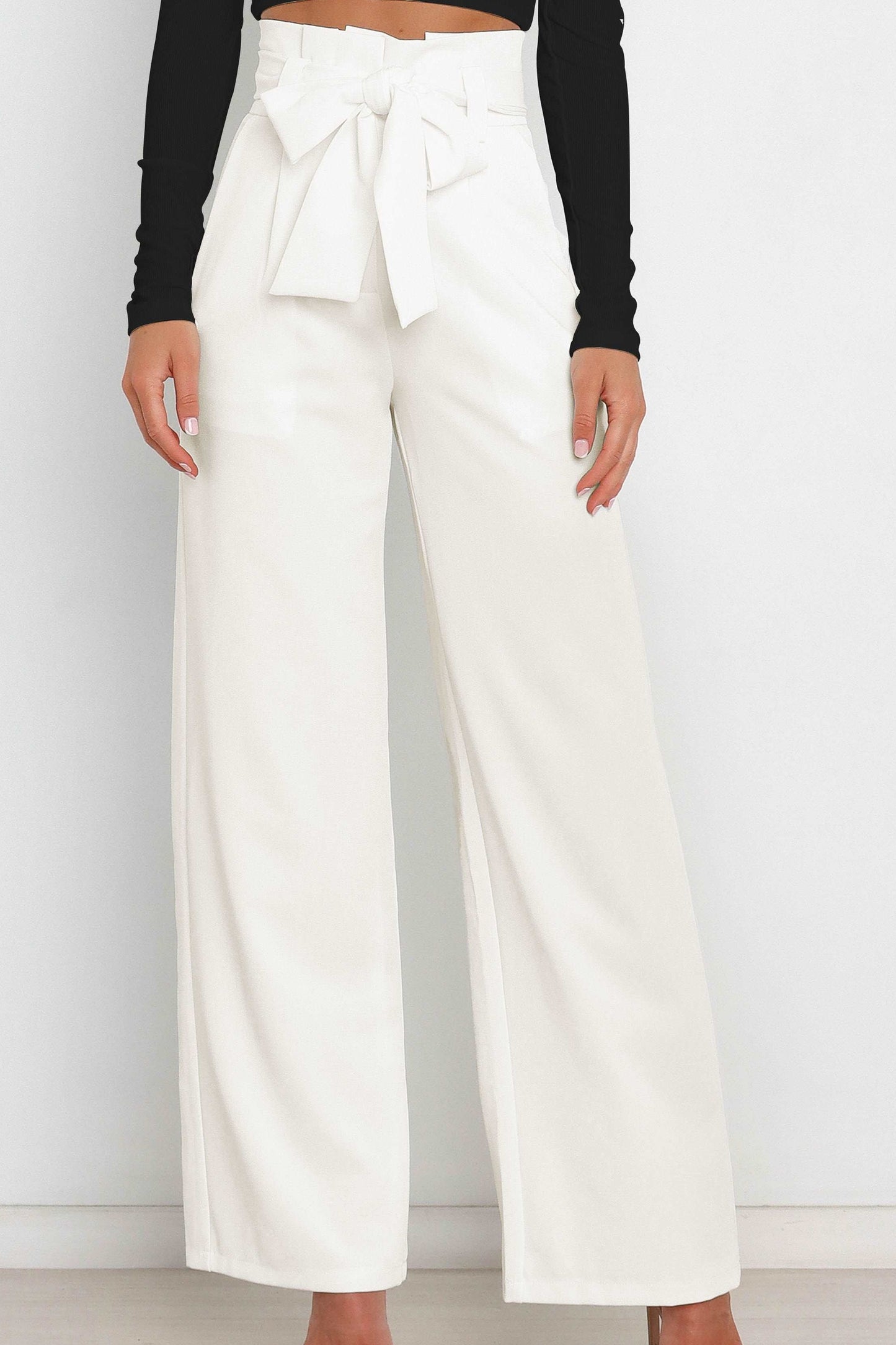 Woman wearing paperbag waist wide leg pants