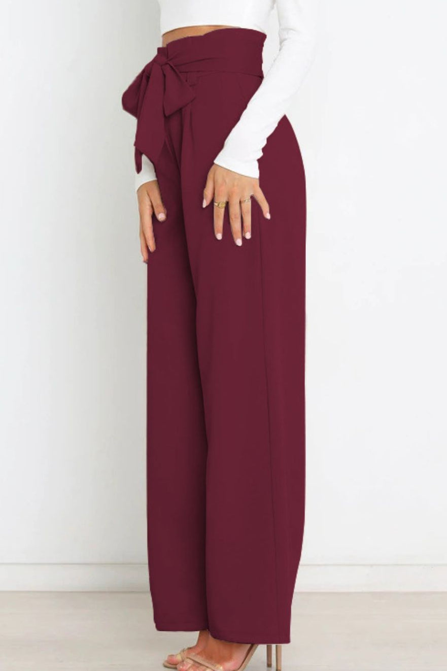 Woman wearing paperbag waist wide leg pants