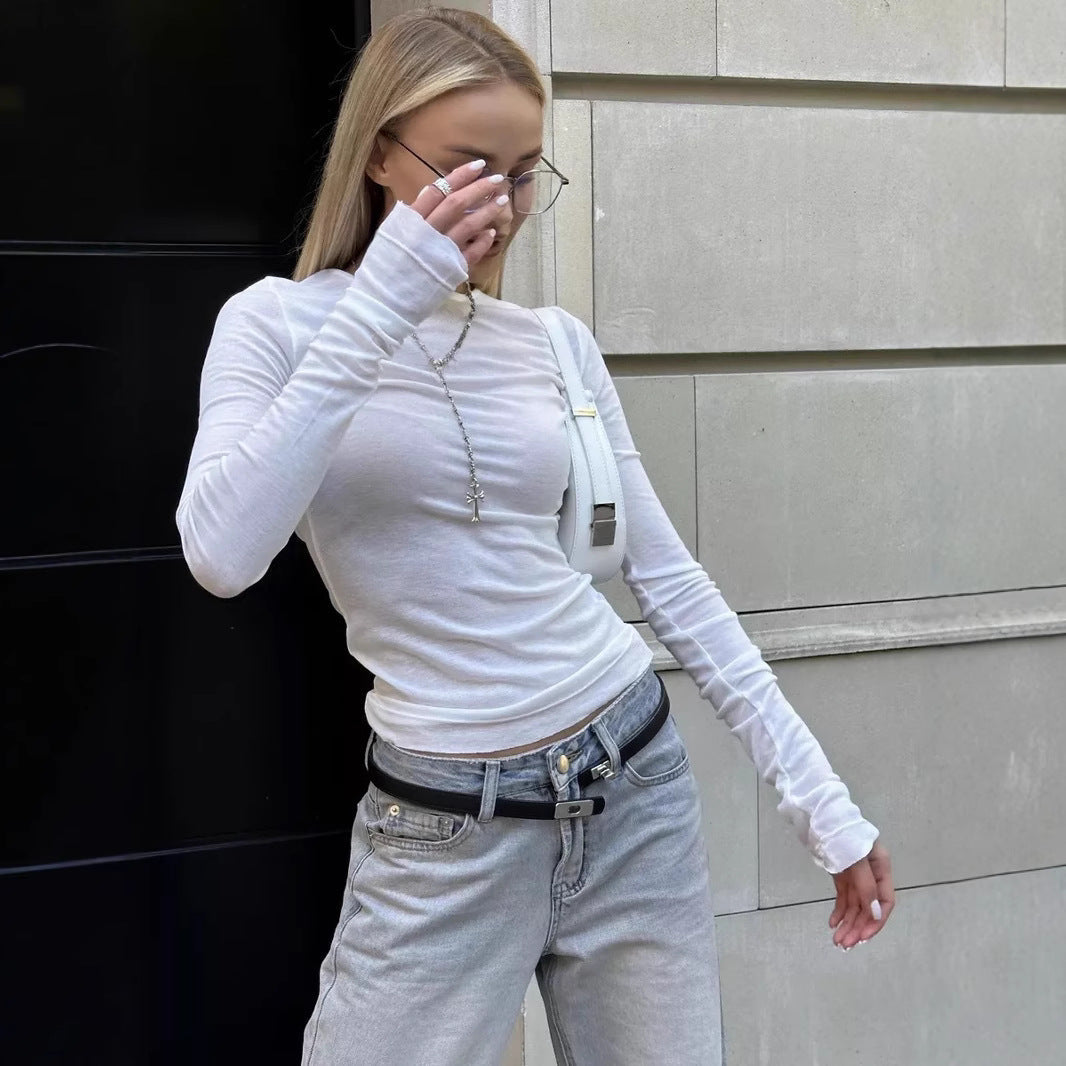 Woman wearing a long sleeve round neck thumbhole top