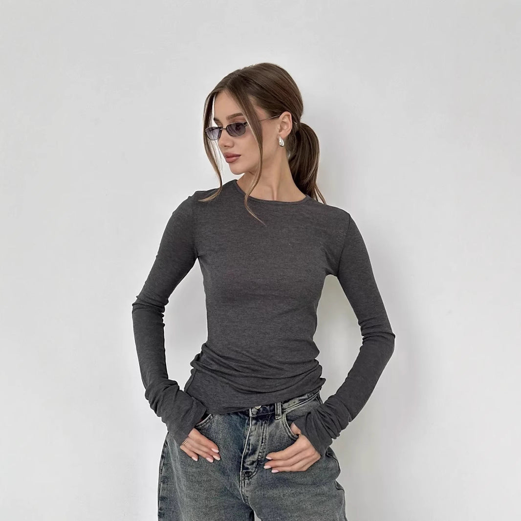 Woman wearing a long sleeve round neck thumbhole top