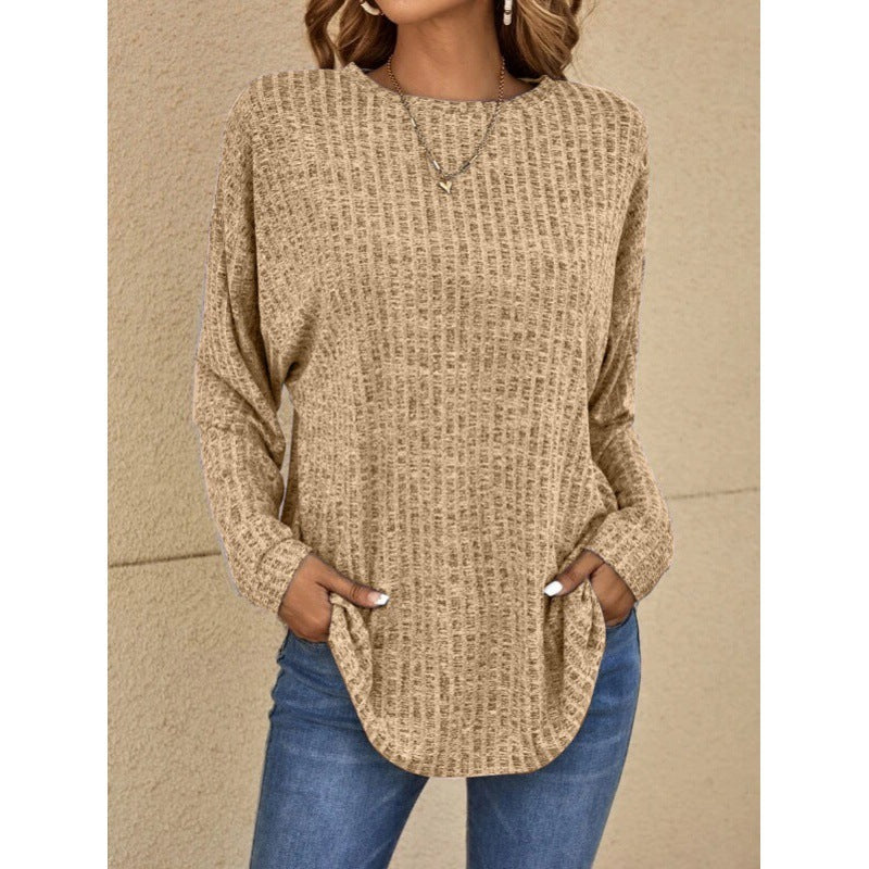 Woman wearing a loose fit long sleeve round neck top