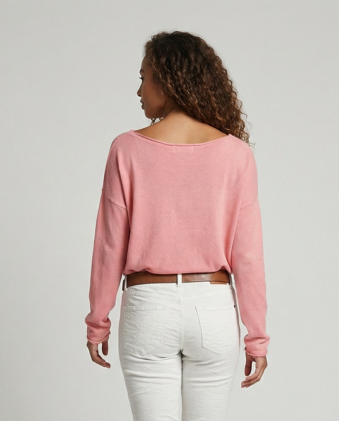 Woman wearing a lightweight long sleeve round neck top