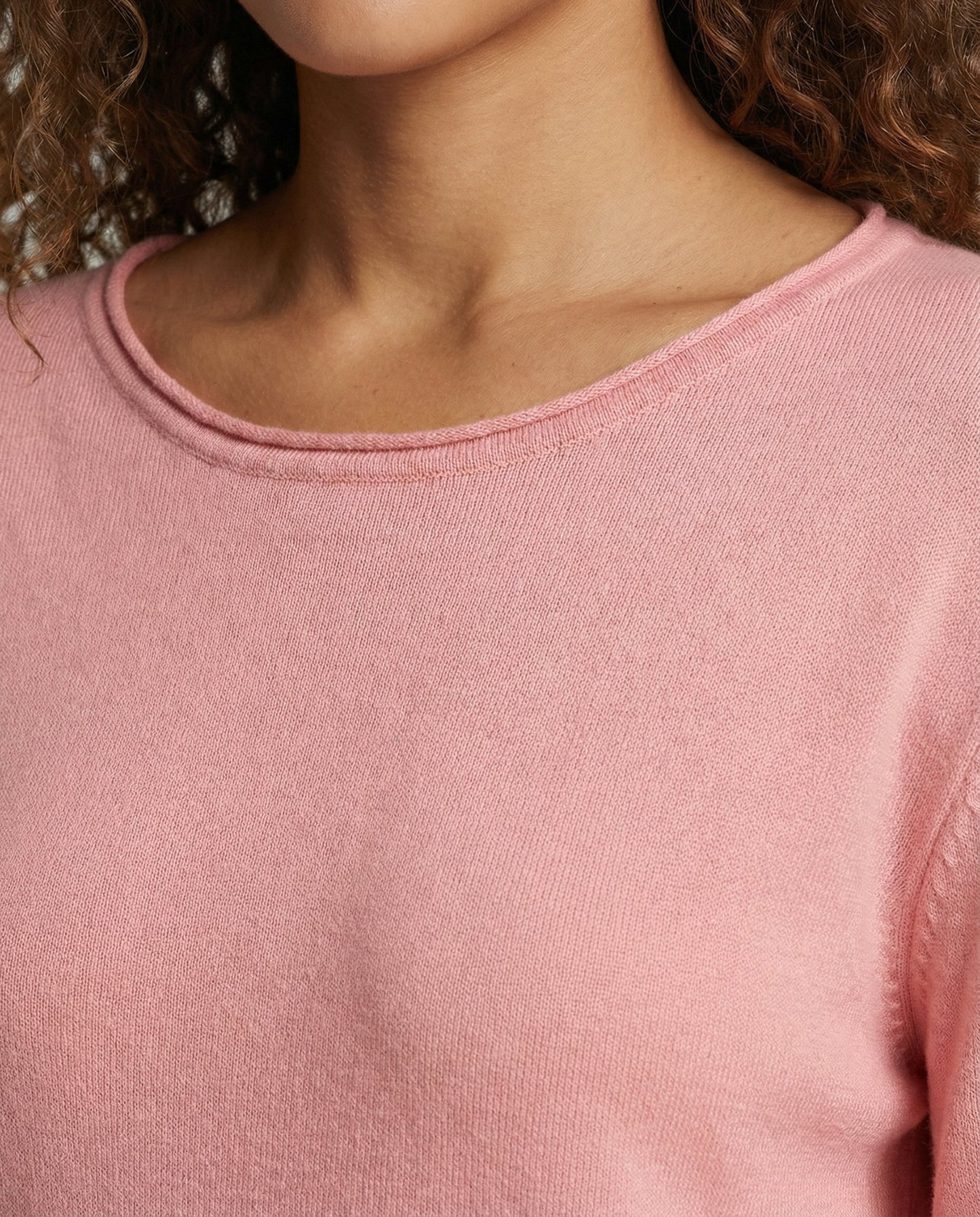 Woman wearing a lightweight long sleeve round neck top