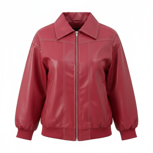 Woman wearing an oversized red faux leather bomber jacket with white contrast stitching