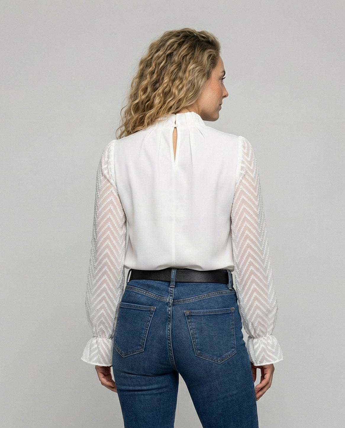 Woman wearing an elegant long sleeve round neck top