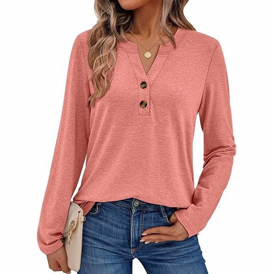 Woman wearing a V-neck long sleeve t-shirt with button detail