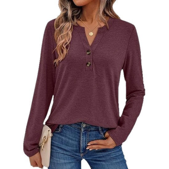 Woman wearing a V-neck long sleeve t-shirt with button detail