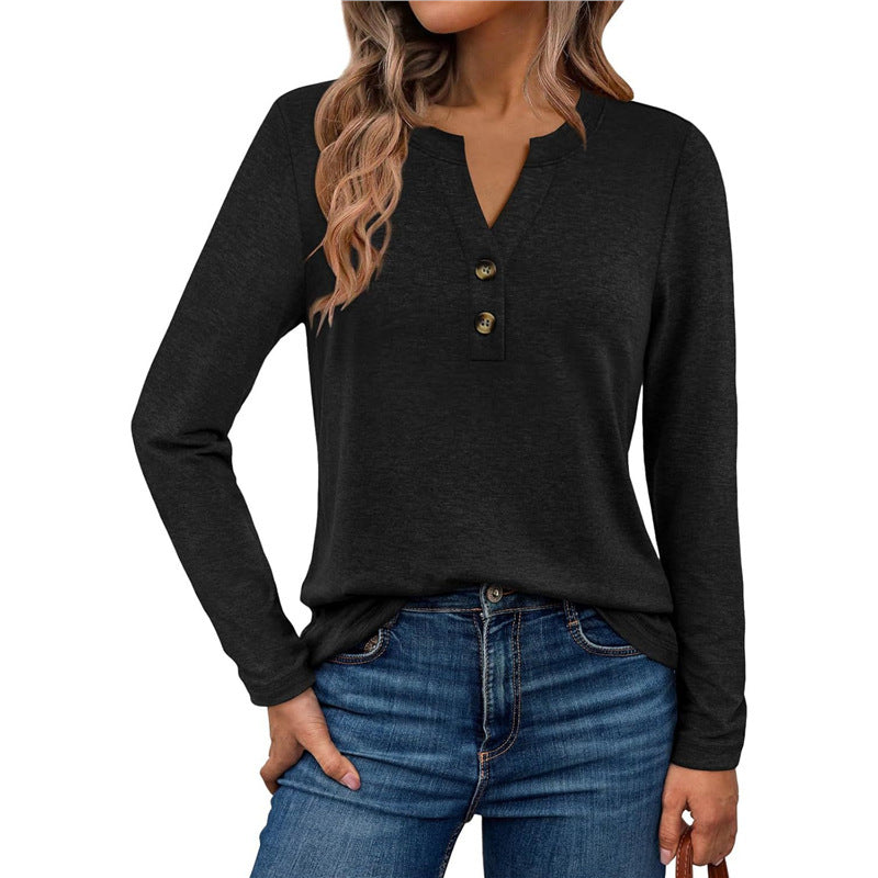 Woman wearing a V-neck long sleeve t-shirt with button detail
