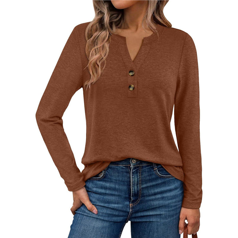 Woman wearing a V-neck long sleeve t-shirt with button detail