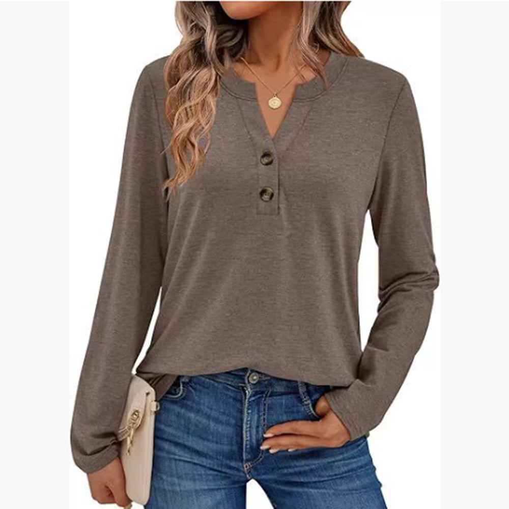 Woman wearing a V-neck long sleeve t-shirt with button detail