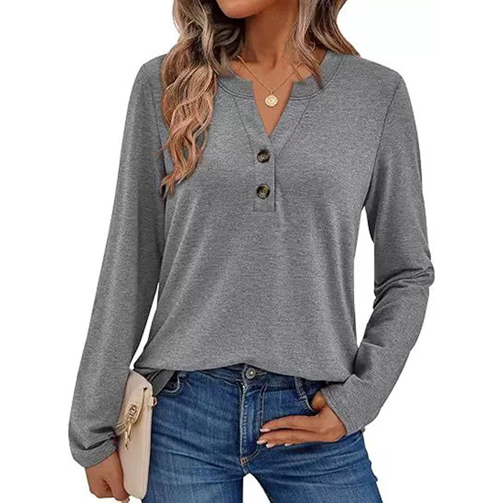 Woman wearing a V-neck long sleeve t-shirt with button detail