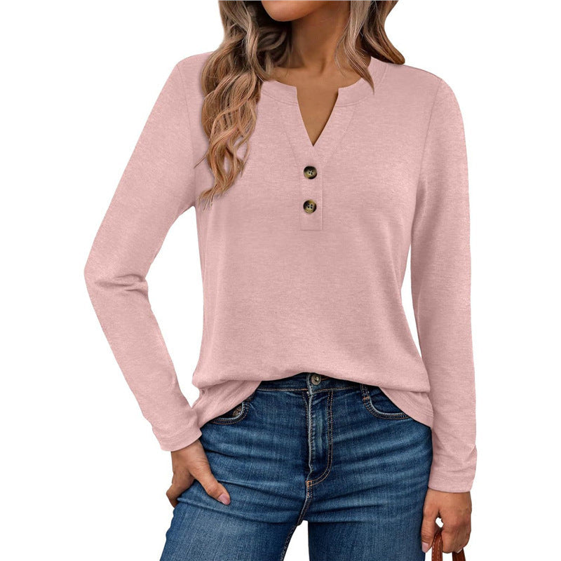 Woman wearing a V-neck long sleeve t-shirt with button detail