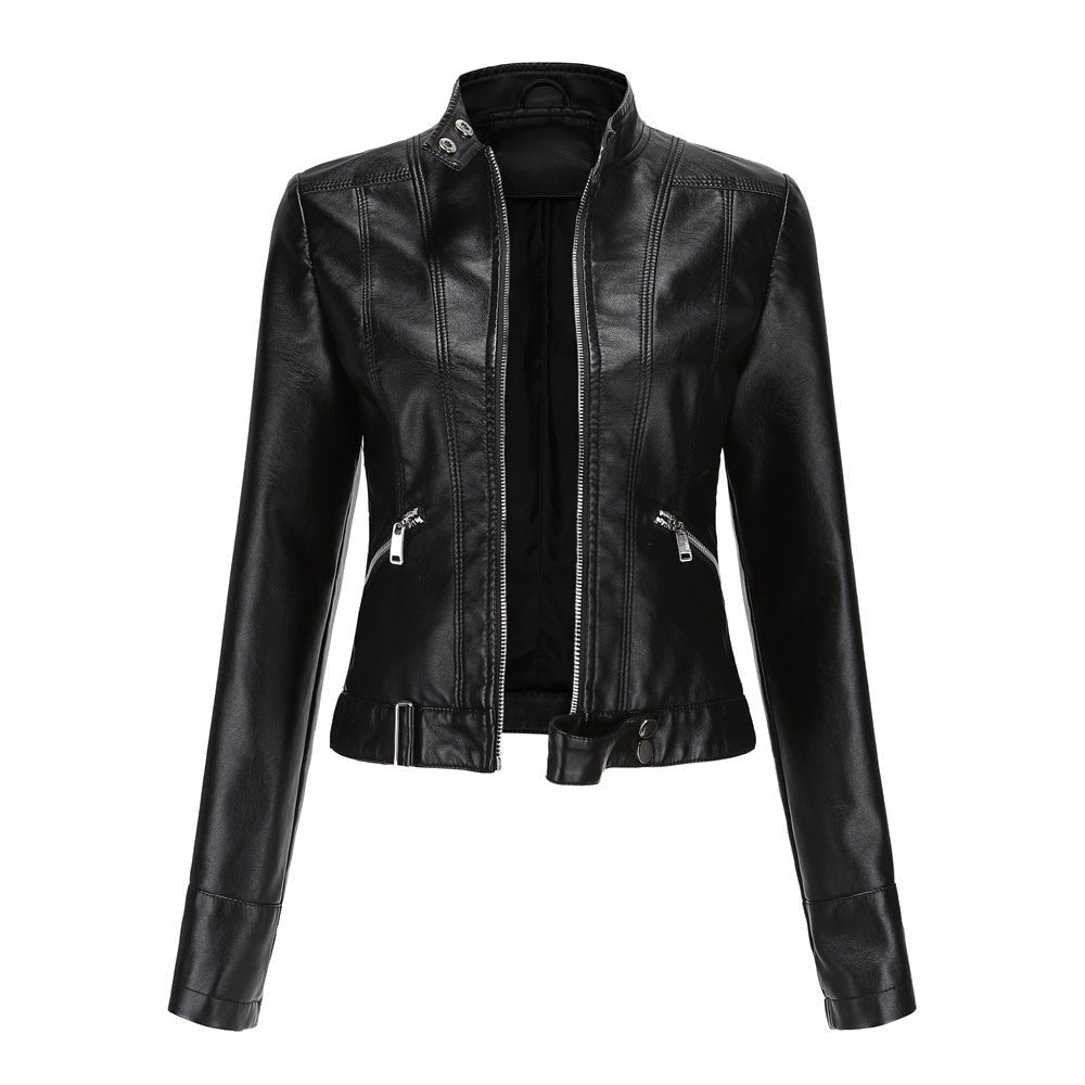 Woman wearing a slim fit faux leather biker jacket with stand collar and zip front