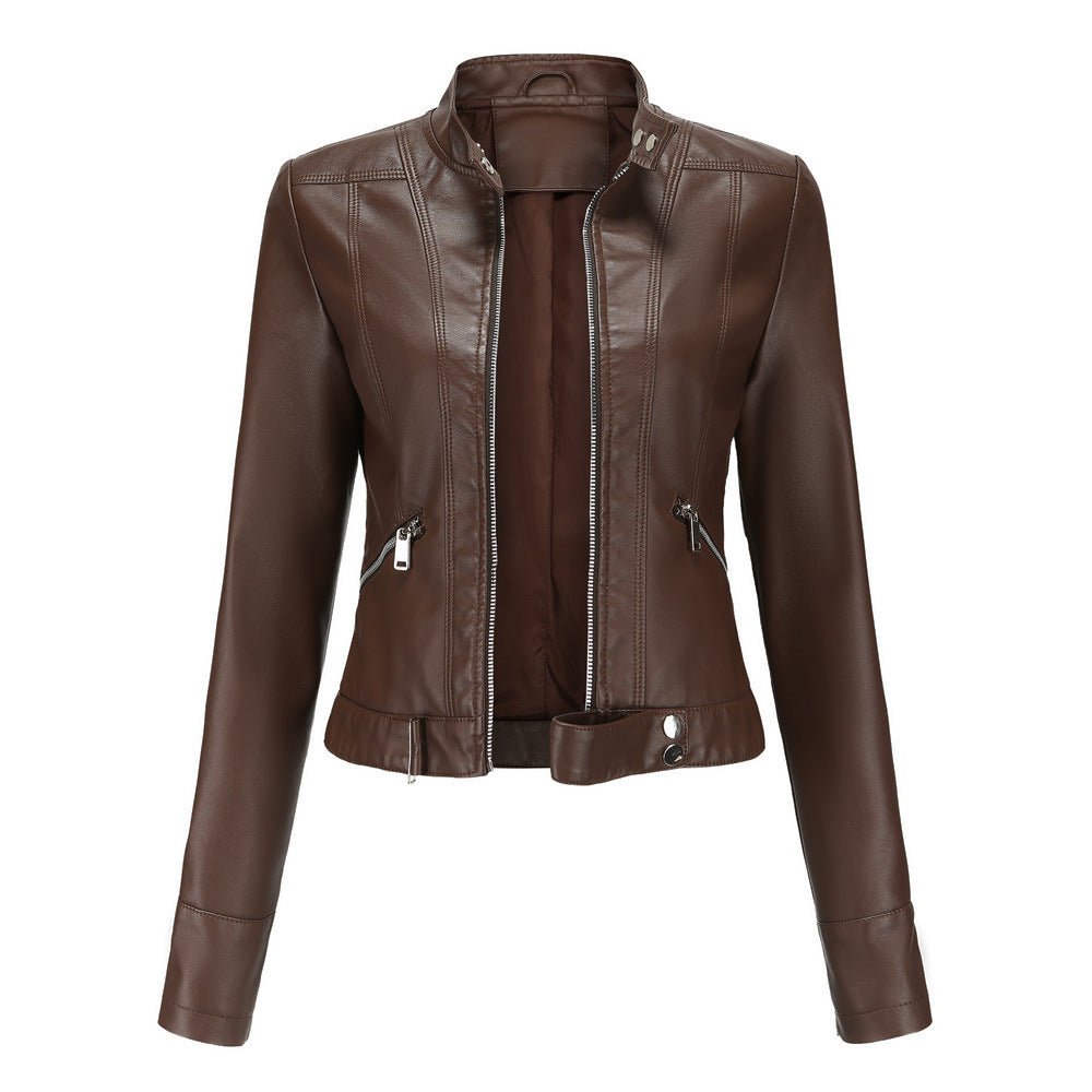 Woman wearing a slim fit faux leather biker jacket with stand collar and zip front