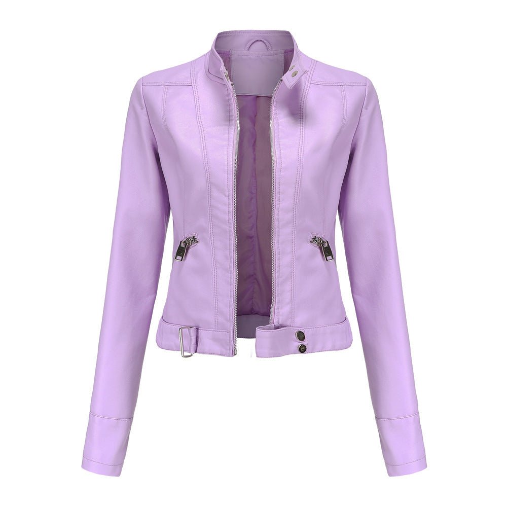 Woman wearing a slim fit faux leather biker jacket with stand collar and zip front