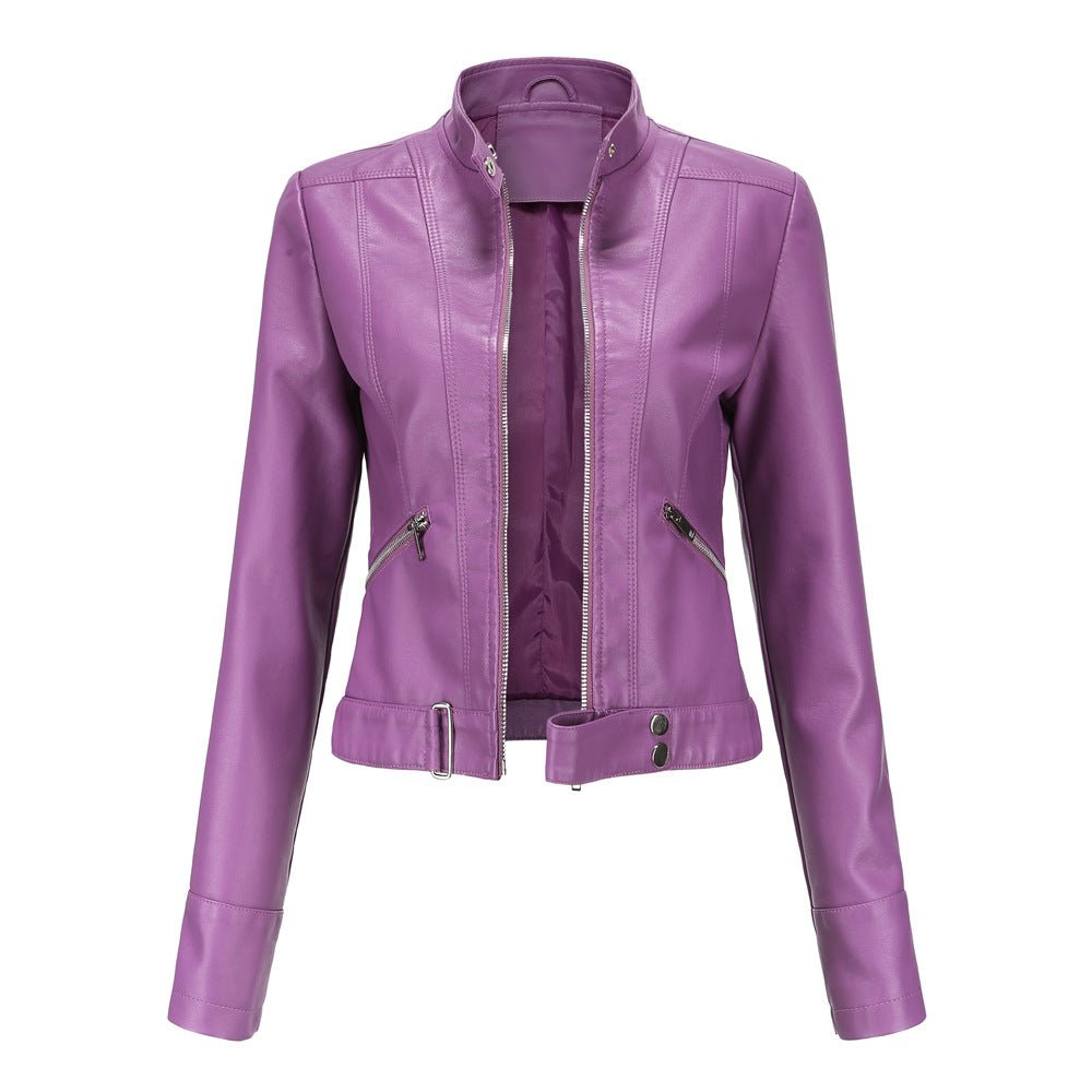 Woman wearing a slim fit faux leather biker jacket with stand collar and zip front
