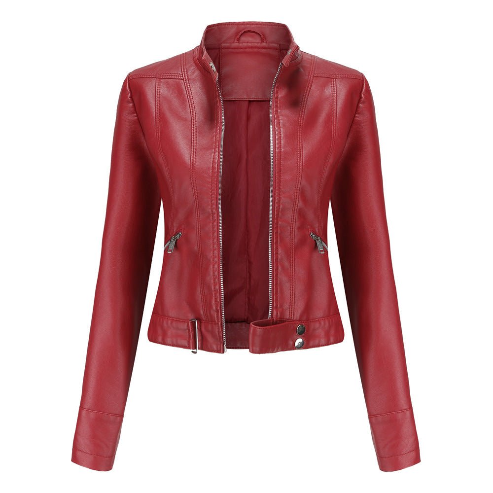 Woman wearing a slim fit faux leather biker jacket with stand collar and zip front
