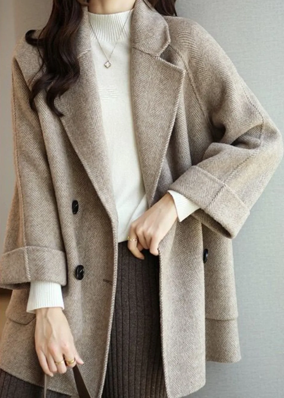 Beige oversized trench coat for women.