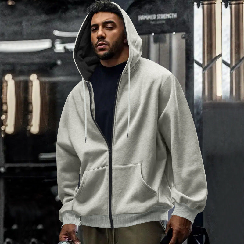 Man wearing an oversized zip up hoodie