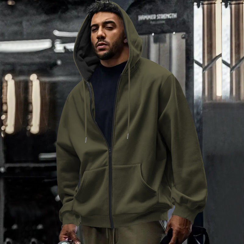 Man wearing an oversized zip up hoodie