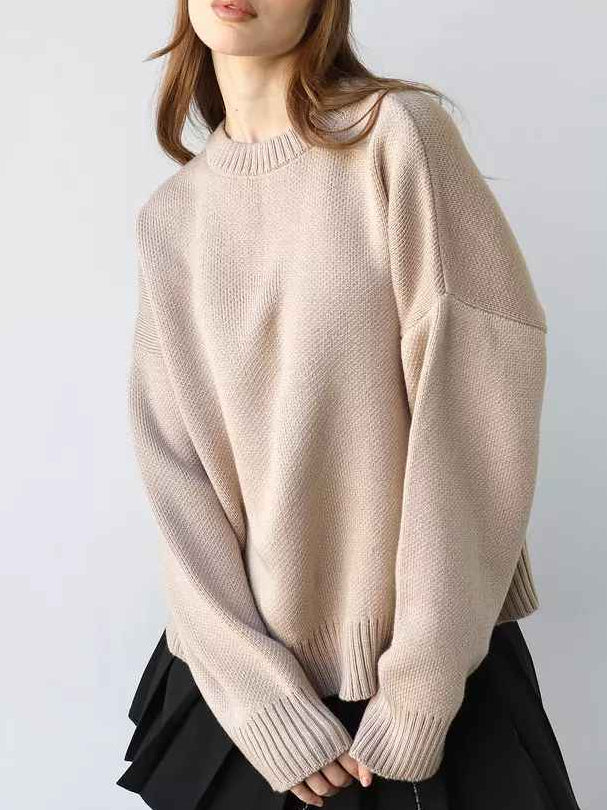 Woman wearing a cozy oversized crew neck sweater