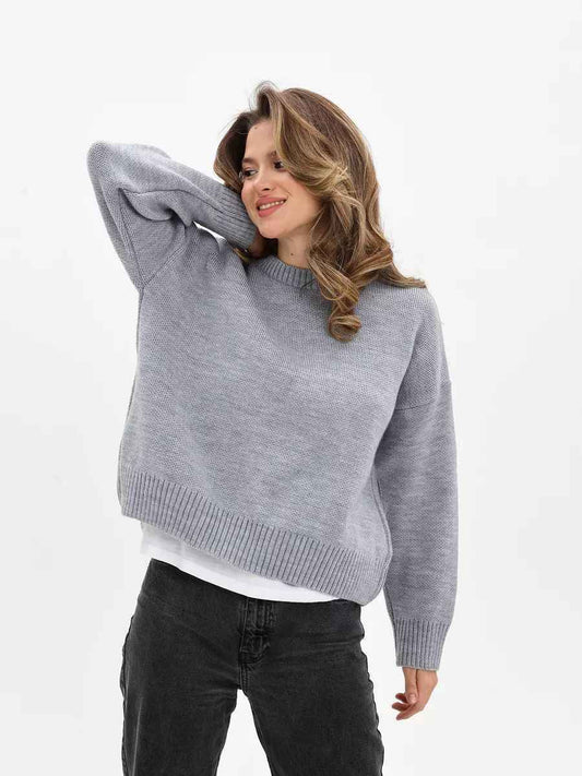 Woman wearing a cozy oversized crew neck sweater