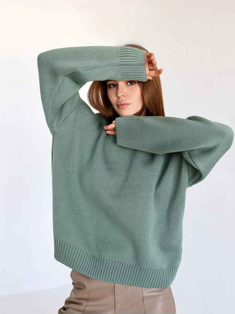 Woman wearing a cozy oversized crew neck sweater