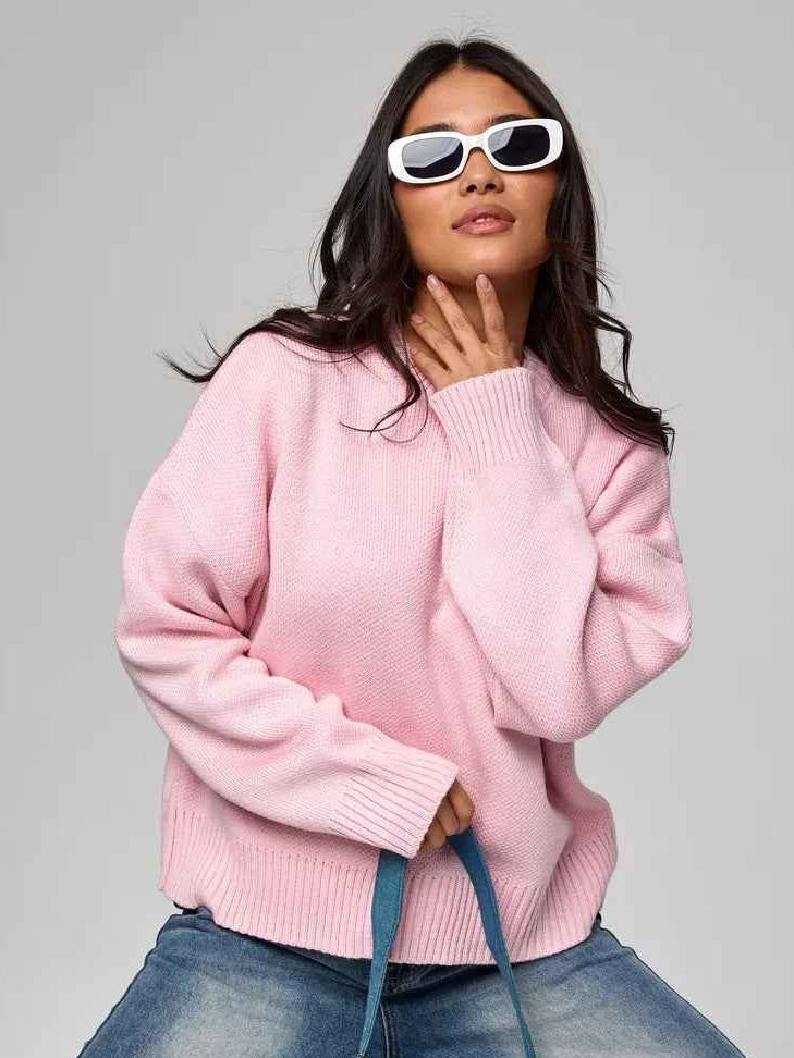 Woman wearing a cozy oversized crew neck sweater