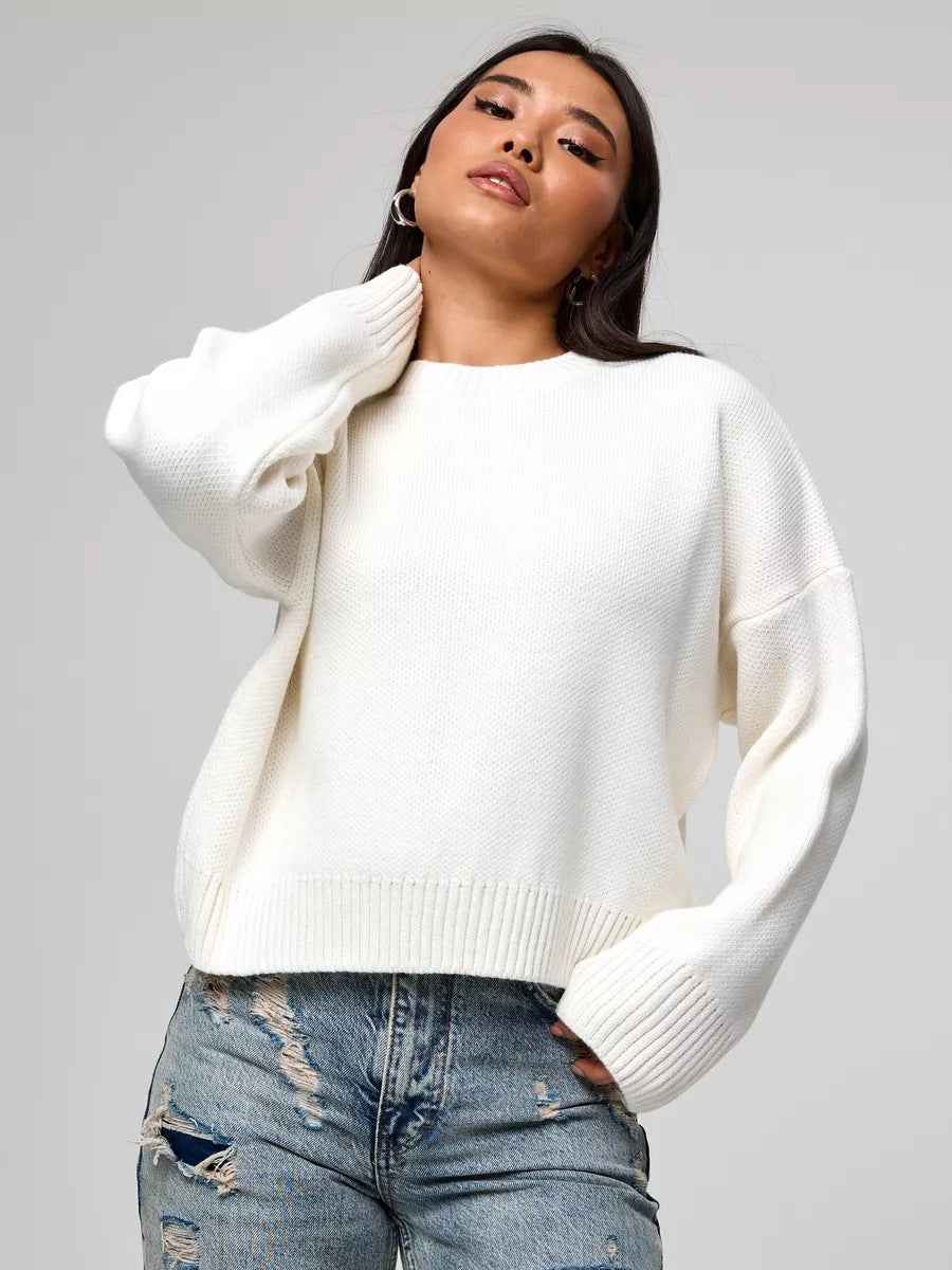 Woman wearing a cozy oversized crew neck sweater