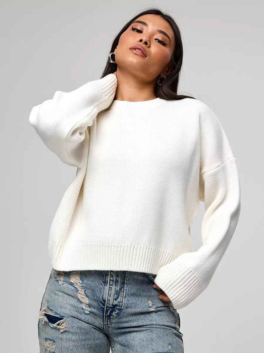 Woman wearing a cozy oversized crew neck sweater