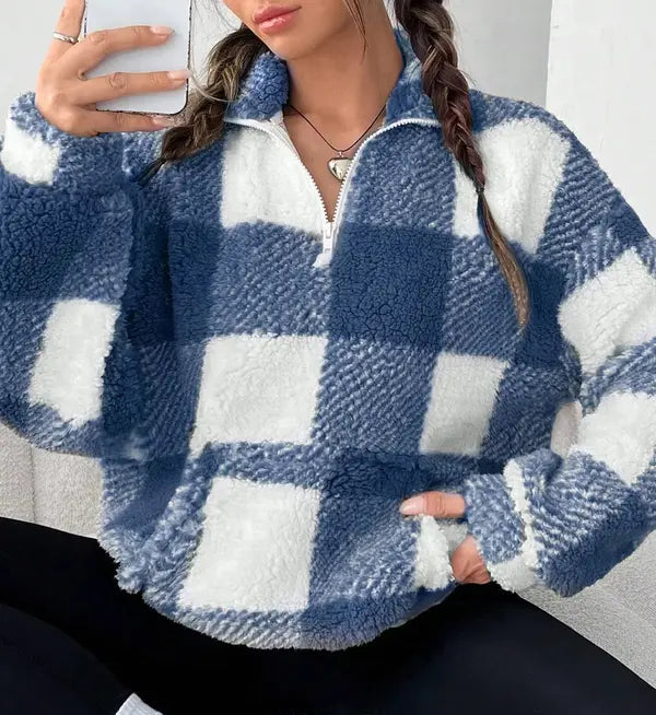 Woman wearing a plaid knit half zip sweater