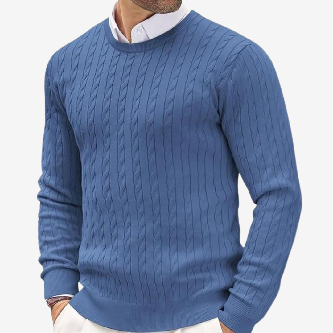 Man wearing a classic cable knit crew neck sweater
