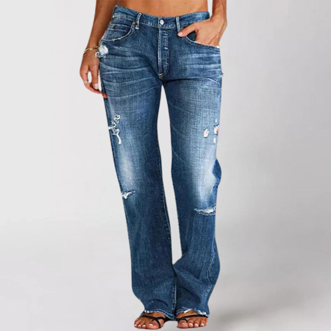 Woman wearing relaxed wide leg distressed denim jeans